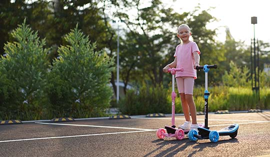 Little girl deals motorized scooter